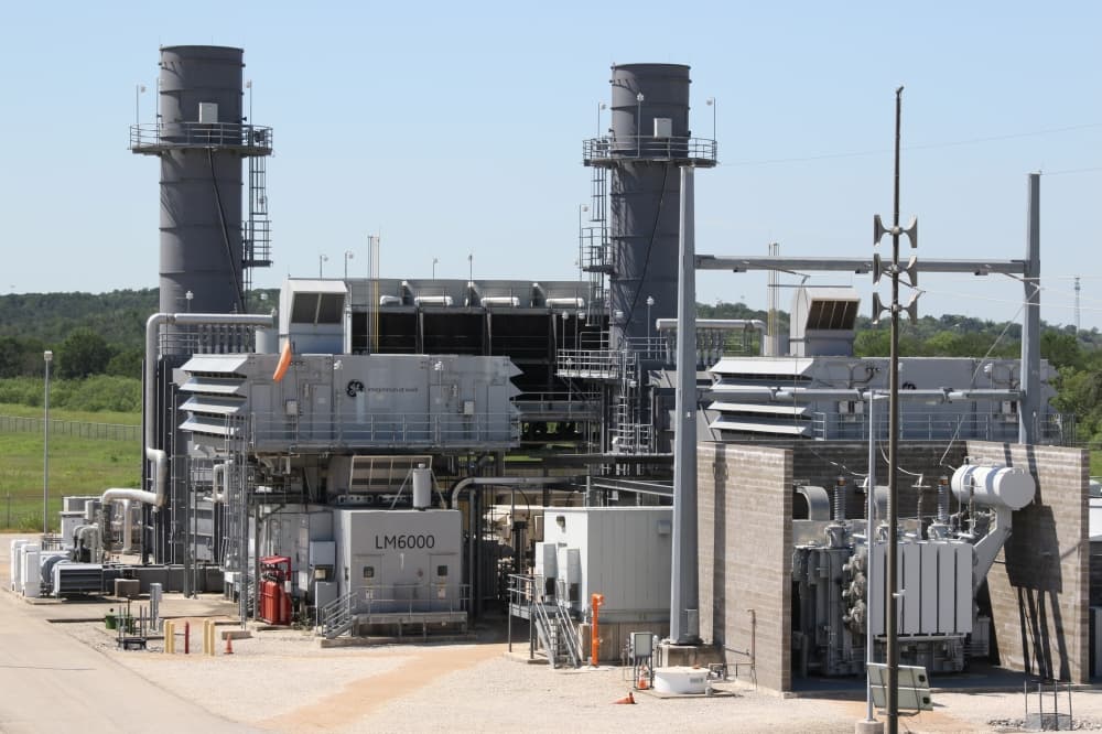 Ground-level photograph of LM6000 gas-turbine units at Sand Hill Energy Center near Austin, Texas